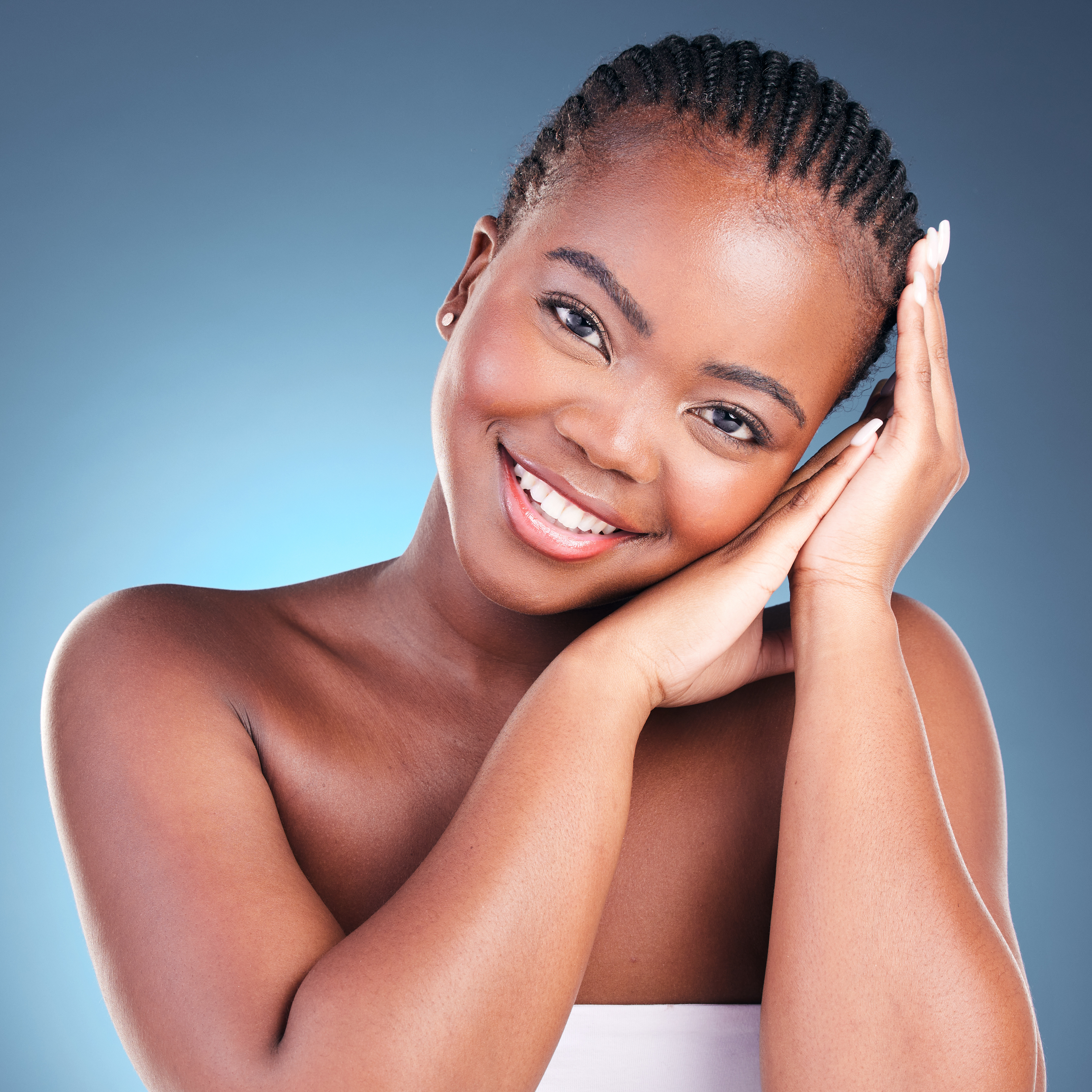 Skincare, portrait and black woman with natural beauty, shine and dermatology on a blue studio back